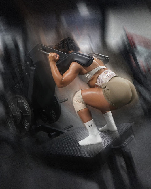 woman using leg machine at the gym